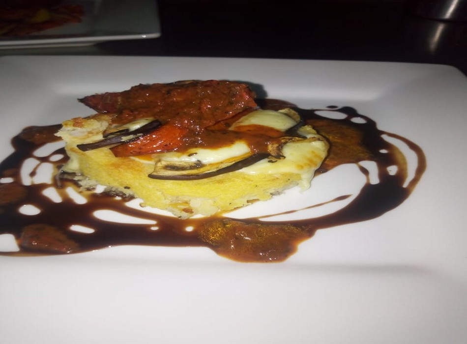 Baked Polenta with Aubergine, Tomato and Mozzarella and Red Pepper  Coulis	